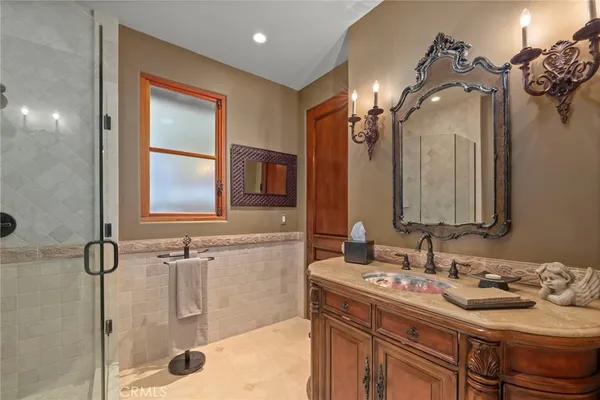 a bathroom with a sink double vanity and a mirror
