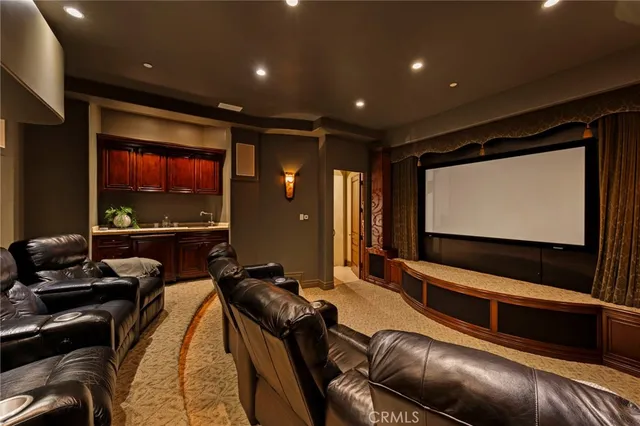 a room with furniture projector screen and projector