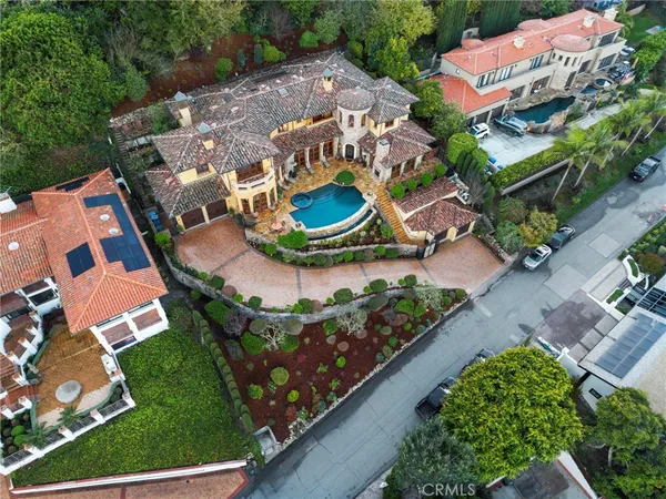 an aerial view of house with yard swimming pool and outdoor seating