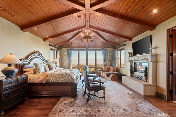 a bed room with furniture and a fireplace
