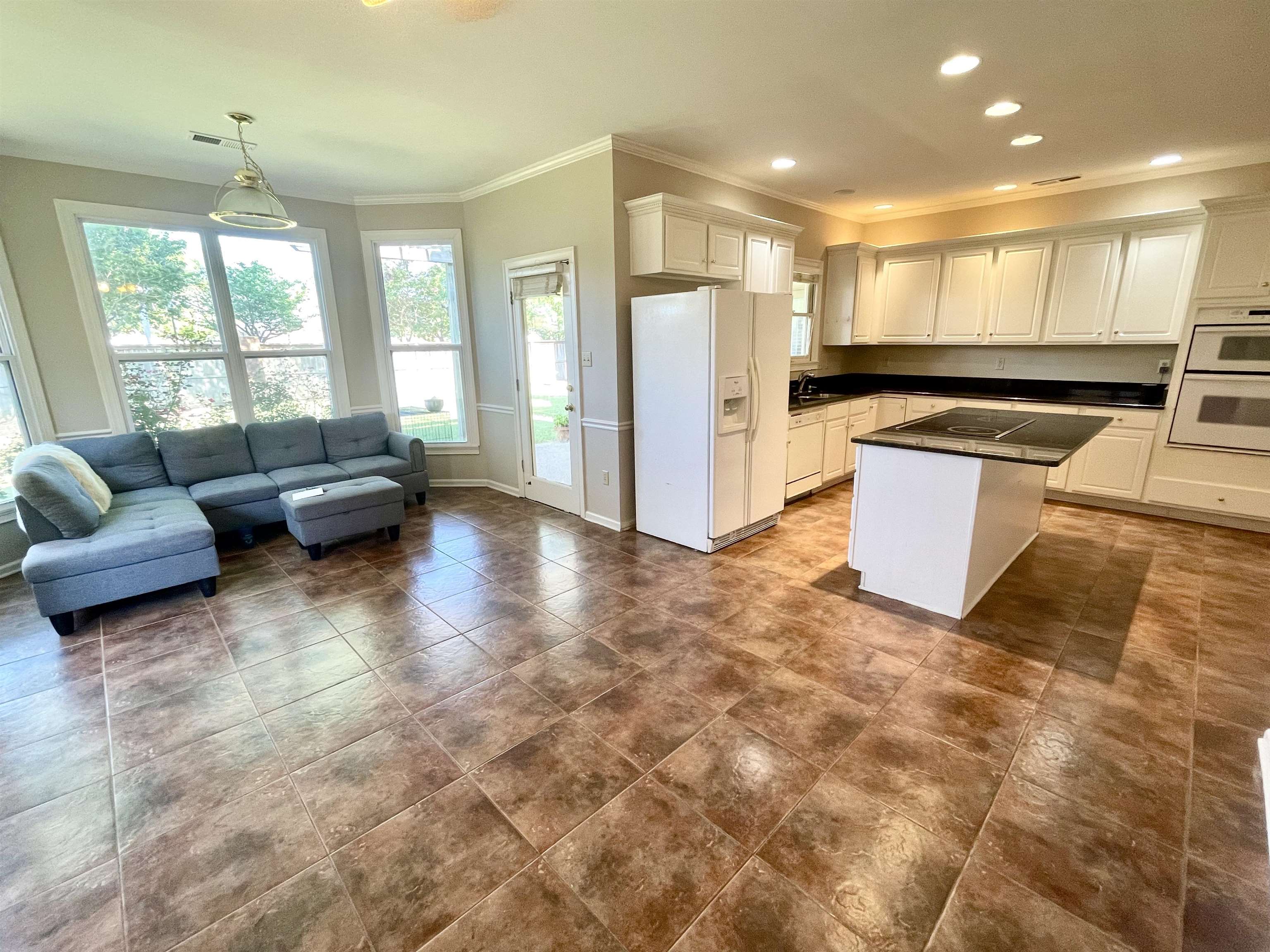 83 McCall Drive Collierville, TN 38017 - Photo 39 of 39 a living room with furniture and a large window