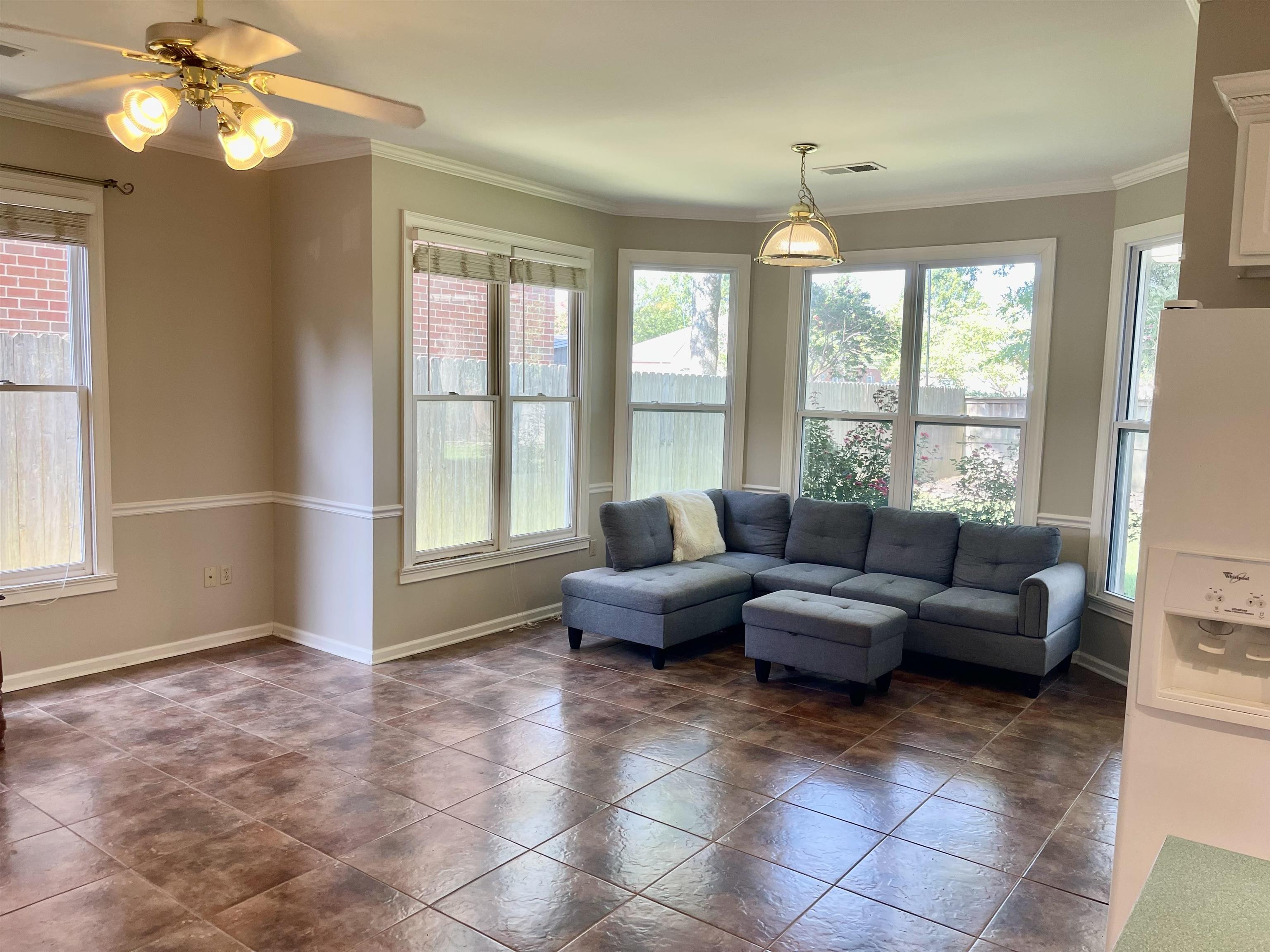 83 McCall Drive Collierville, TN 38017 - Photo 17 of 39 a living room with furniture and a large window