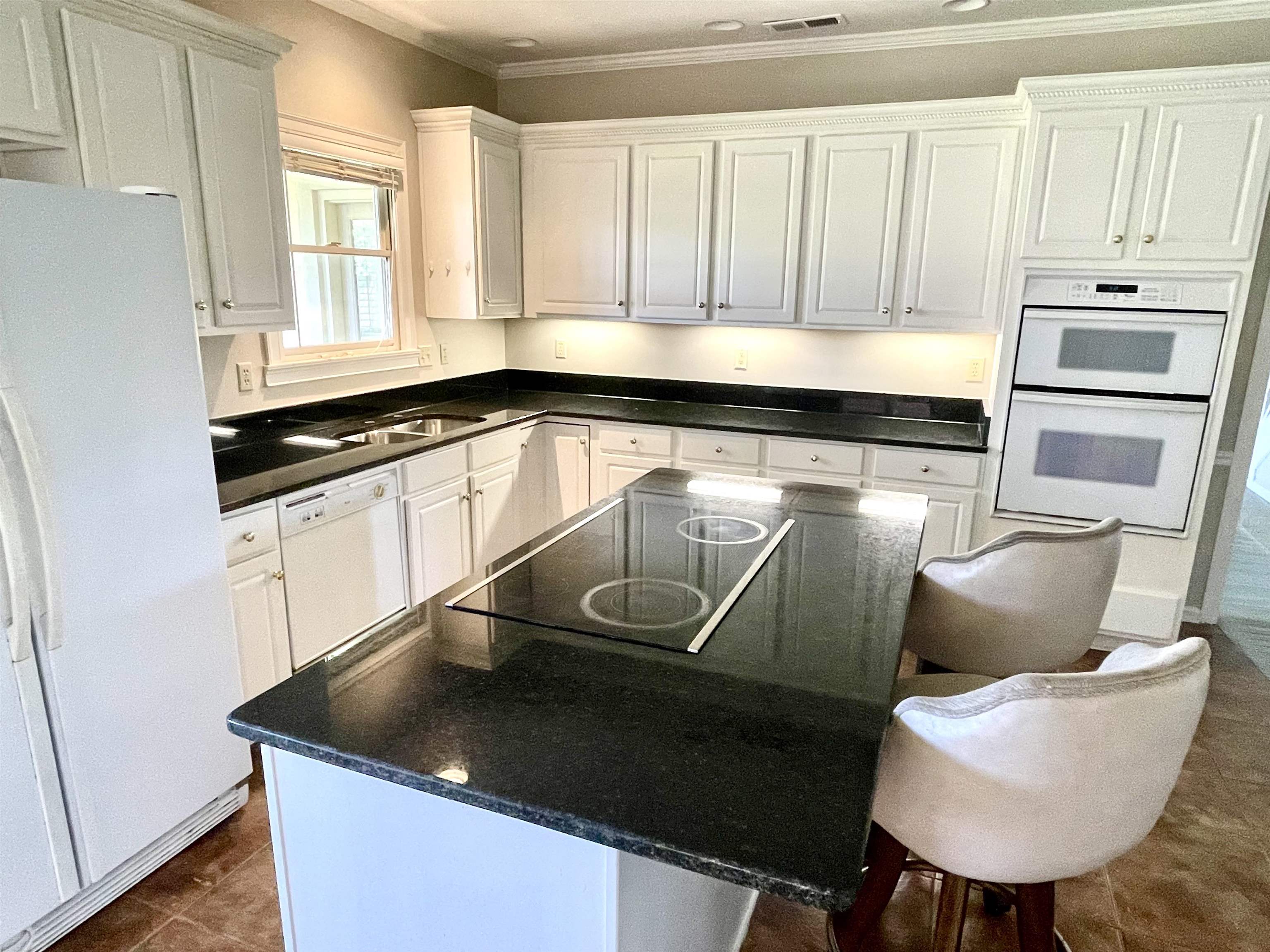 83 McCall Drive Collierville, TN 38017 - Photo 18 of 39 a kitchen with a sink a stove and a microwave