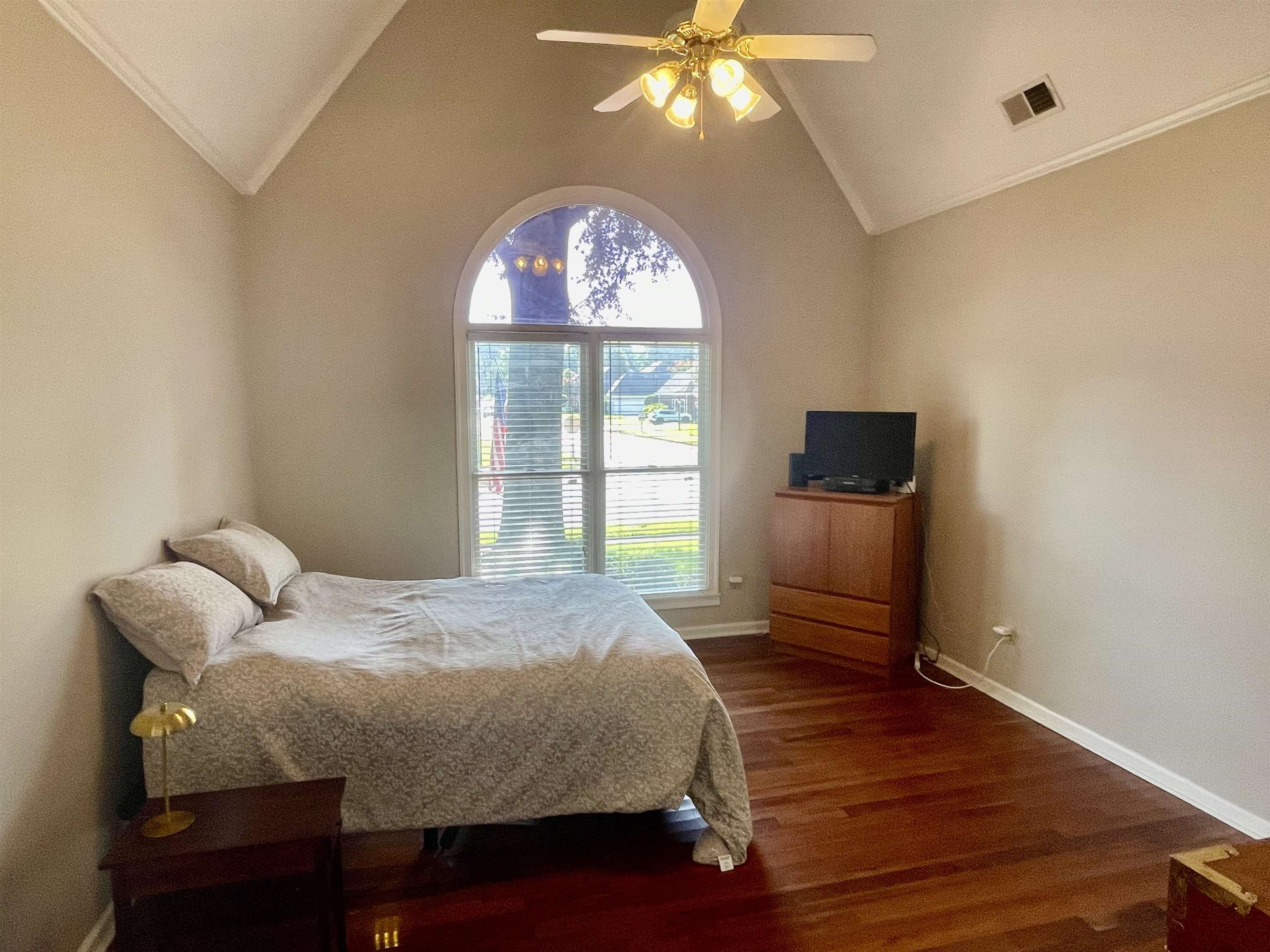 83 McCall Drive Collierville, TN 38017 - Photo 21 of 39 a bedroom with a bed and a chandelier