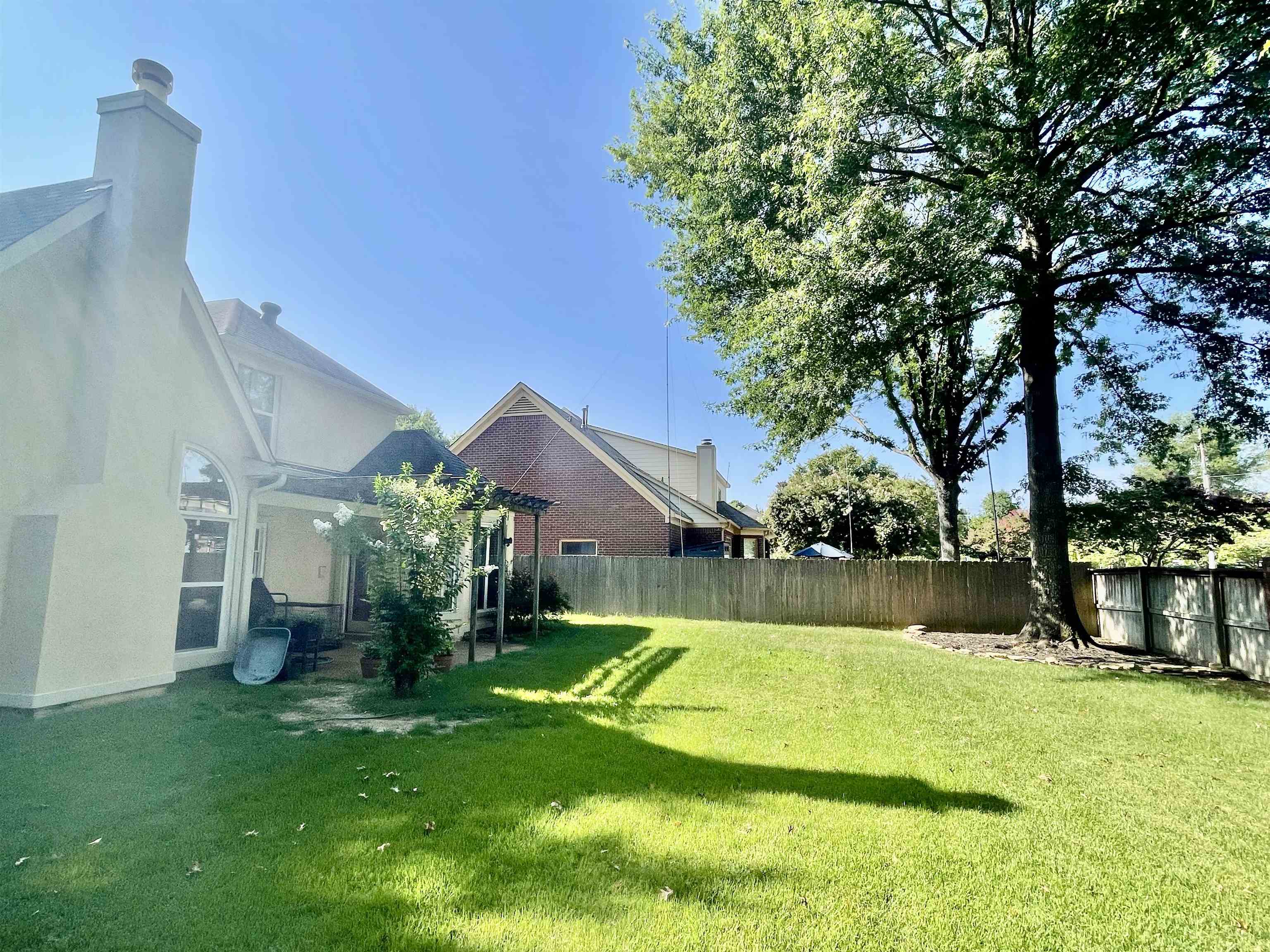 83 McCall Drive Collierville, TN 38017 - Photo 35 of 39 a view of a house with swimming pool and a yard