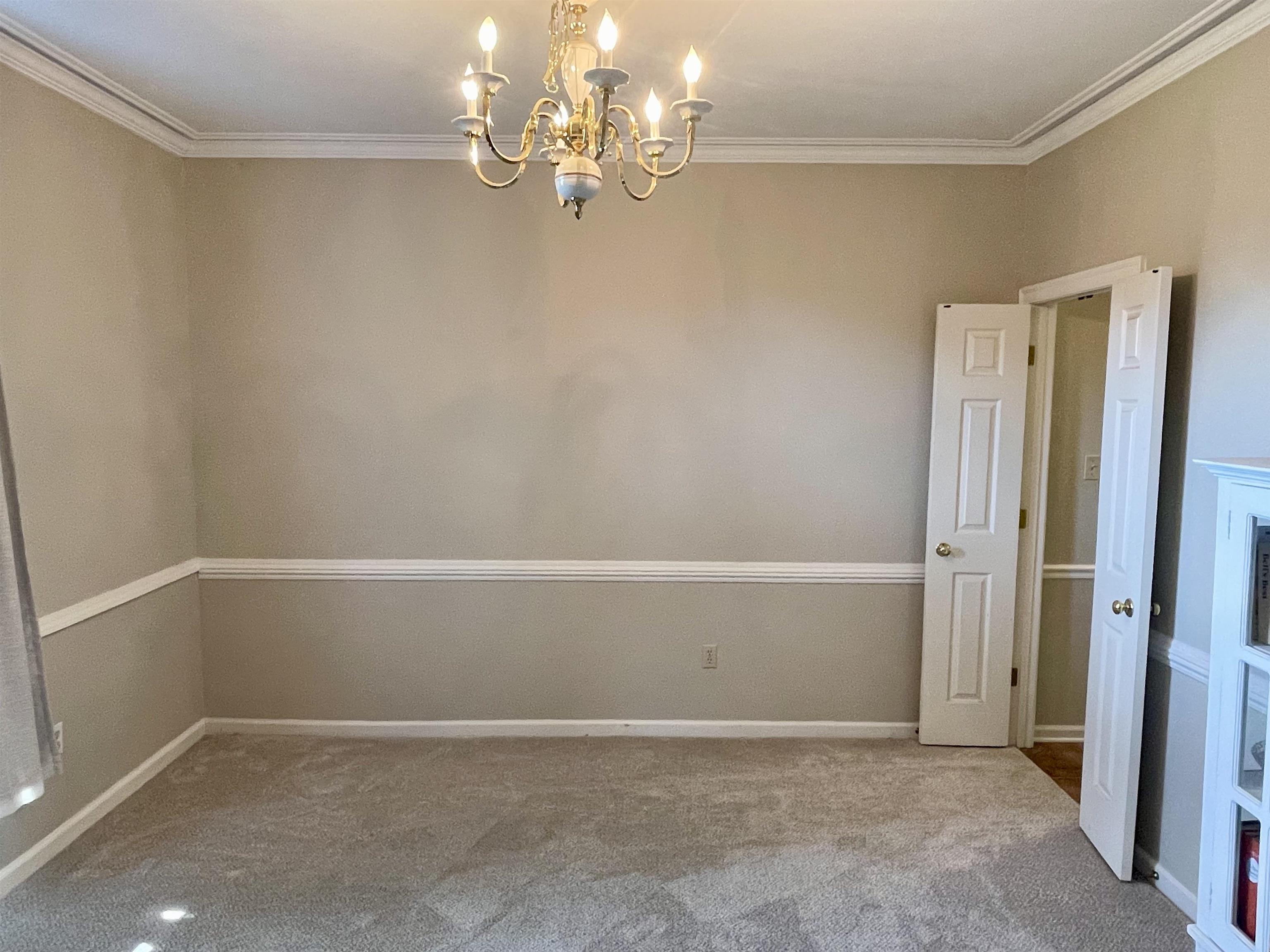 83 McCall Drive Collierville, TN 38017 - Photo 4 of 39 a view of an empty room with chandelier