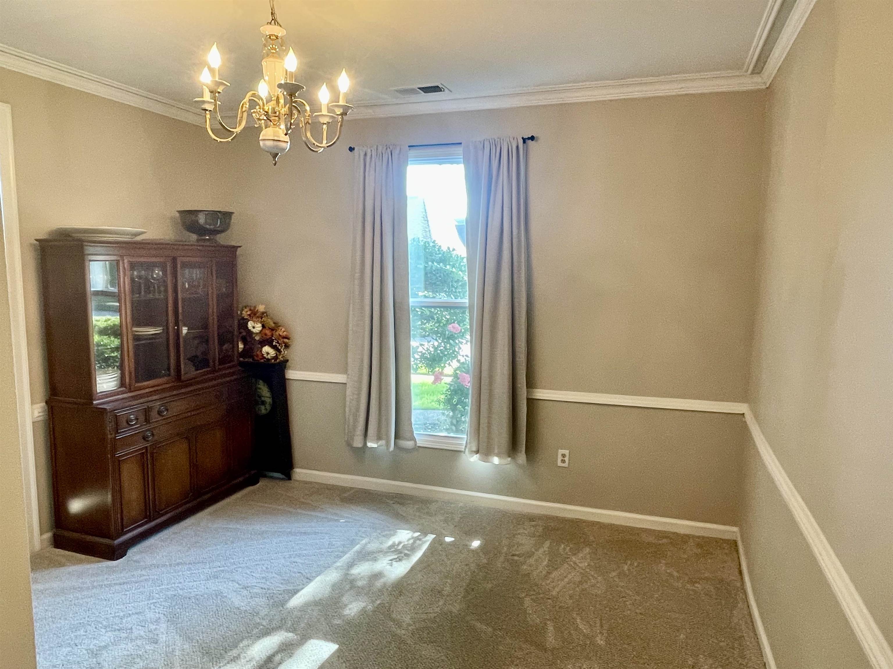 83 McCall Drive Collierville, TN 38017 - Photo 6 of 39 a view of a room with window and furniture