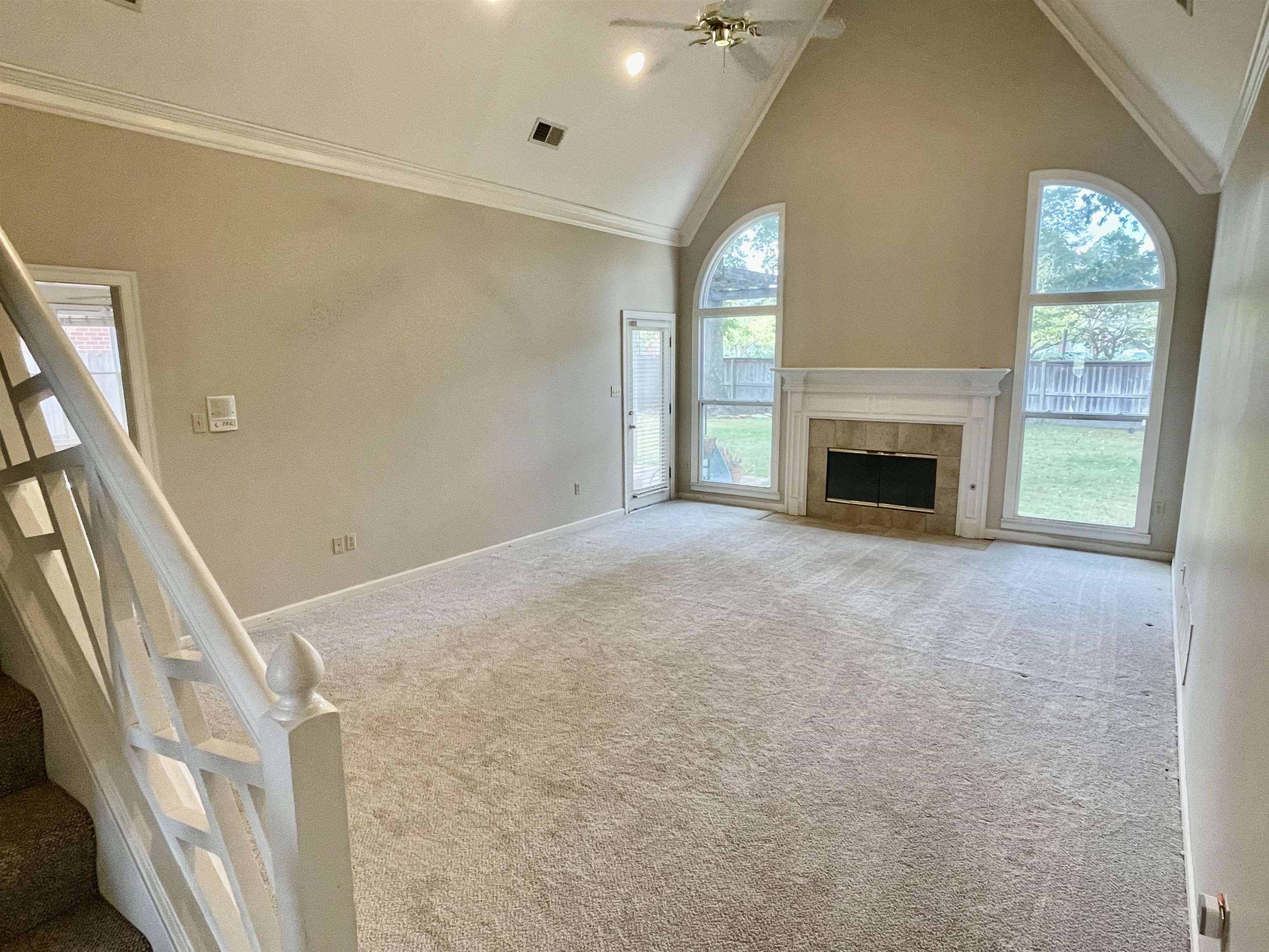 83 McCall Drive Collierville, TN 38017 - Photo 9 of 39 a view of an empty room with a fireplace and a window