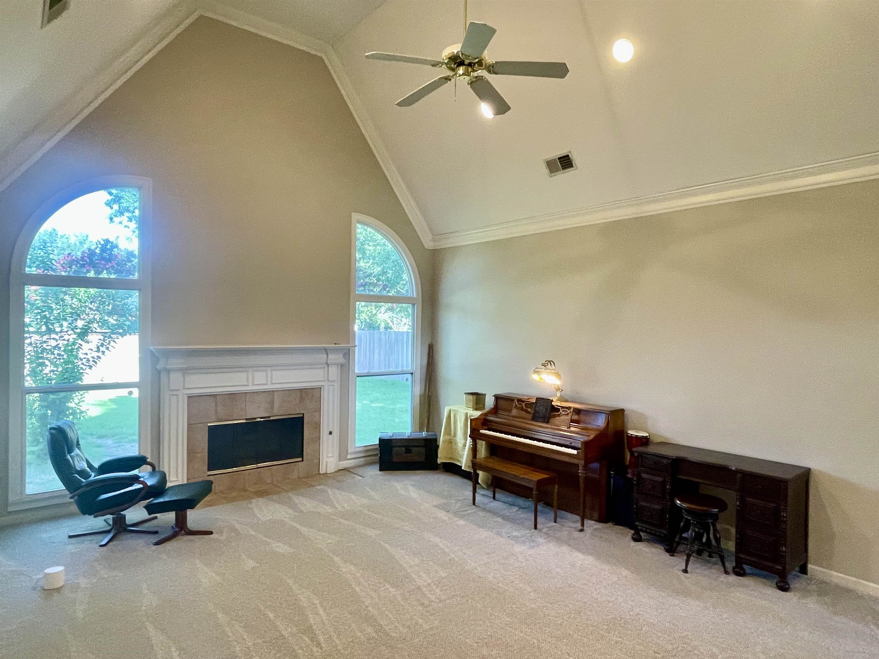 83 McCall Drive Collierville, TN 38017 - Photo 10 of 39 a living room with furniture a fireplace and a window