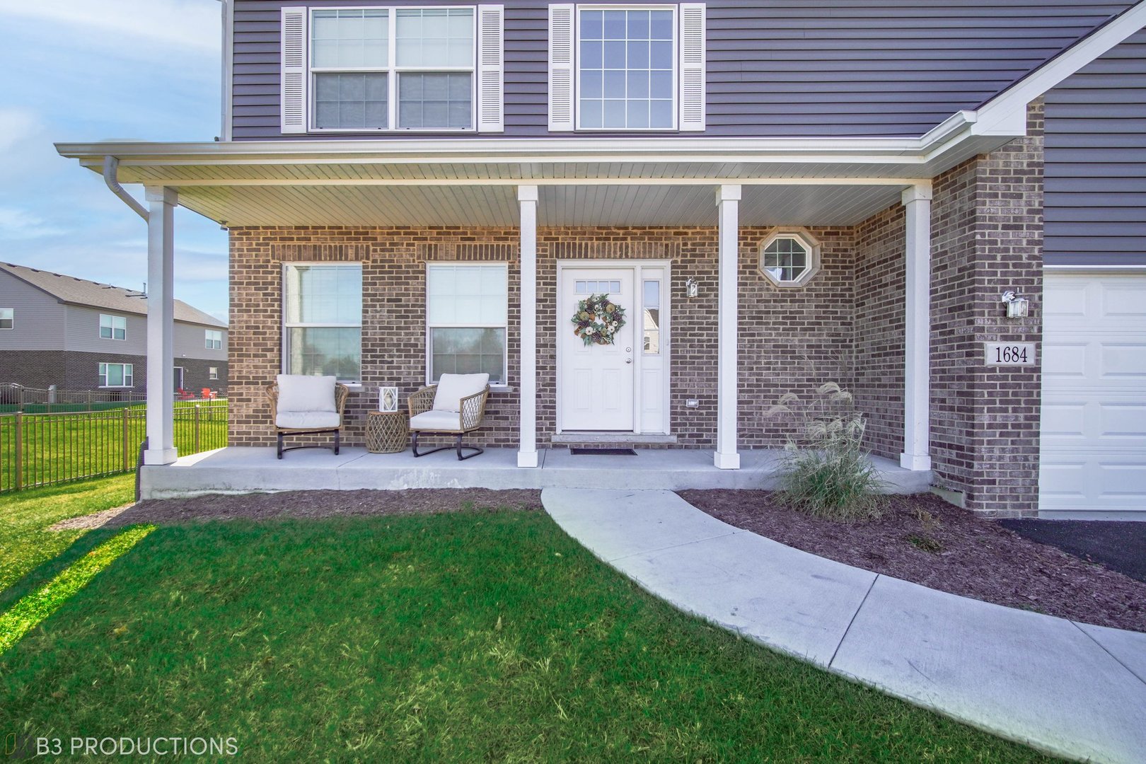 1684 Edentenny Road New Lenox, IL 60451 - Photo 2 of 22 a view of a patio with table and chairs and potted plants