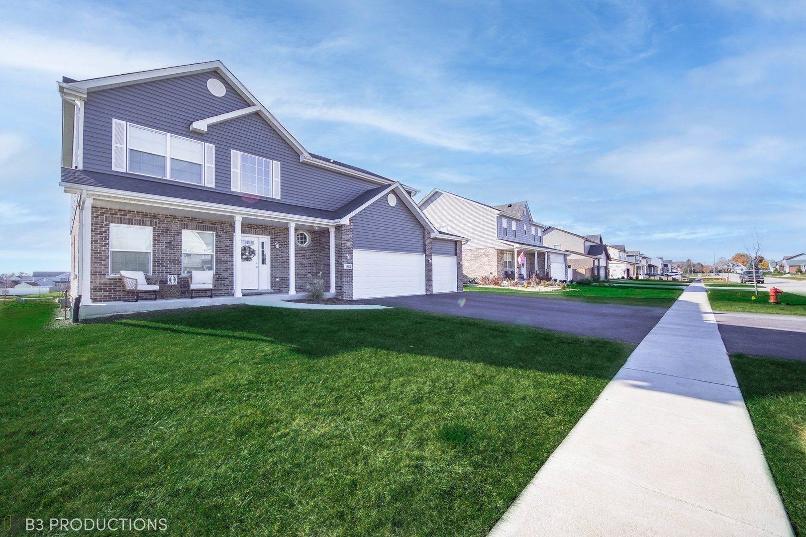 1684 Edentenny Road New Lenox, IL 60451 - Photo 21 of 22 a front view of house with yard and green space