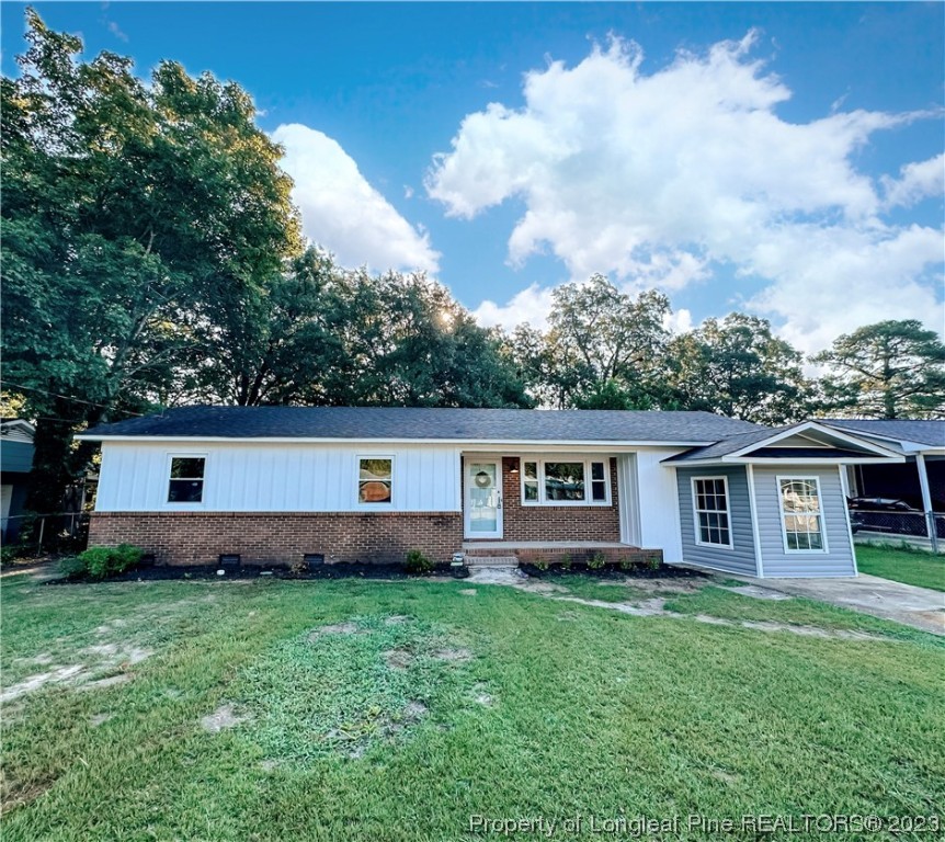 1645 Flintshire Road Fayetteville, NC 28304 - Photo 1 of 22 a front view of house with yard and green space
