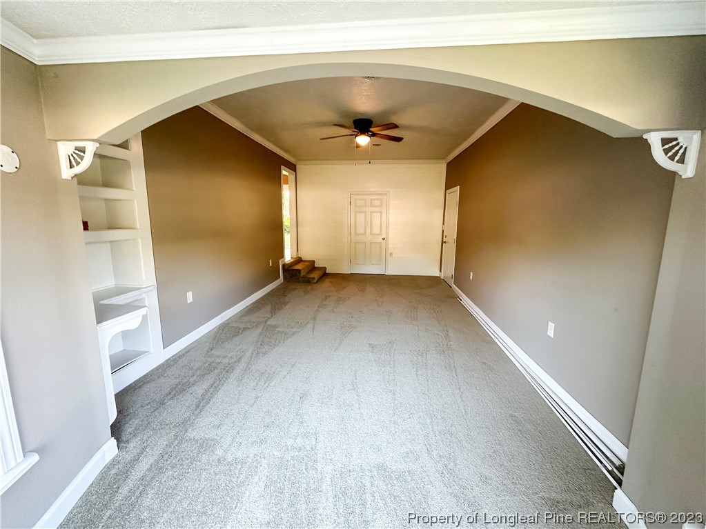 1645 Flintshire Road Fayetteville, NC 28304 - Photo 11 of 22 a view of a big room with wooden floor and windows