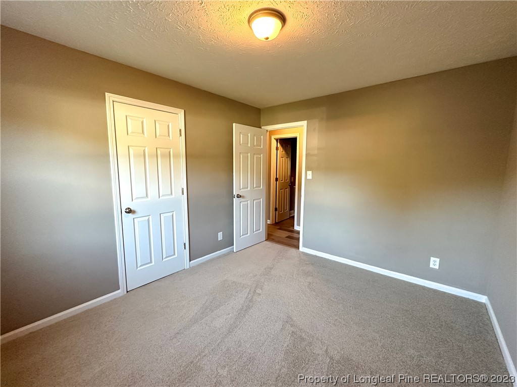 1645 Flintshire Road Fayetteville, NC 28304 - Photo 14 of 22 an empty room with windows