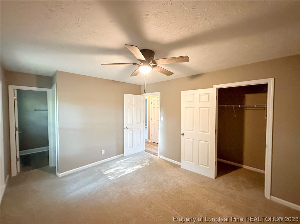 1645 Flintshire Road Fayetteville, NC 28304 - Photo 16 of 22 a view of an empty room with a ceiling fan