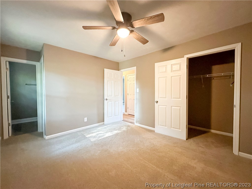 1645 Flintshire Road Fayetteville, NC 28304 - Photo 17 of 22 an empty room with closet and a ceiling fan
