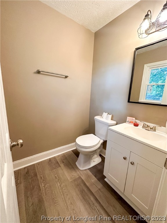 1645 Flintshire Road Fayetteville, NC 28304 - Photo 19 of 22 a bathroom with a toilet sink and mirror