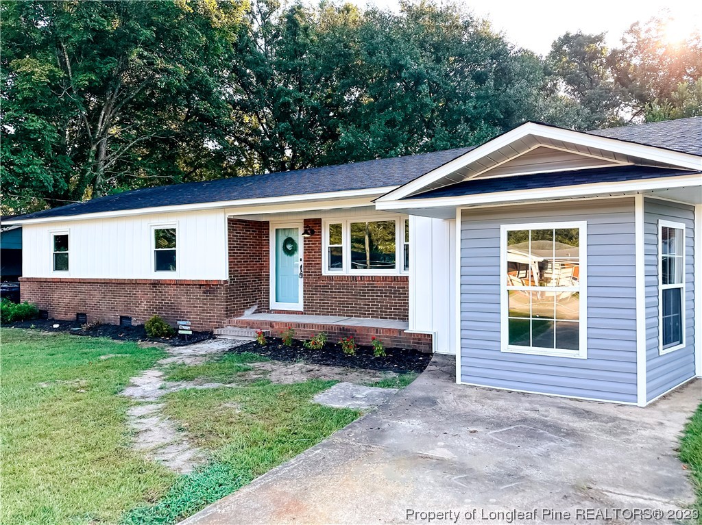1645 Flintshire Road Fayetteville, NC 28304 - Photo 2 of 22 a view of a house with a yard