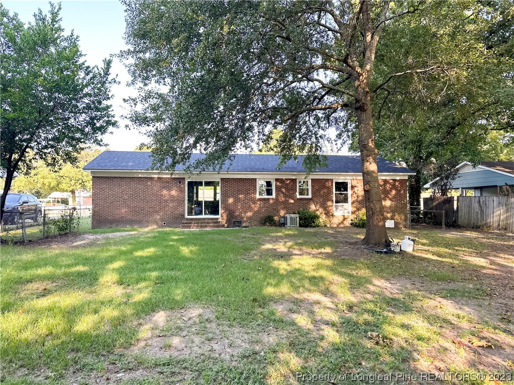 1645 Flintshire Road Fayetteville, NC 28304 - Photo 21 of 22 a view of a yard in front of a house with large tree
