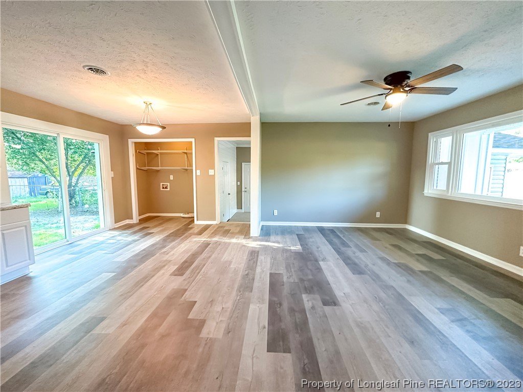 1645 Flintshire Road Fayetteville, NC 28304 - Photo 3 of 22 a view of empty room with wooden floor and fan