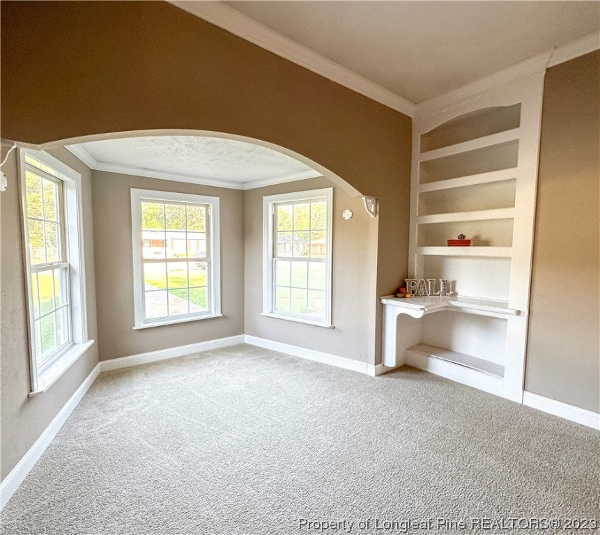 1645 Flintshire Road Fayetteville, NC 28304 - Photo 10 of 22 a view of an empty room with a window