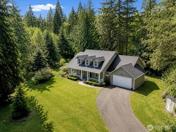 an aerial view of a house with swimming pool