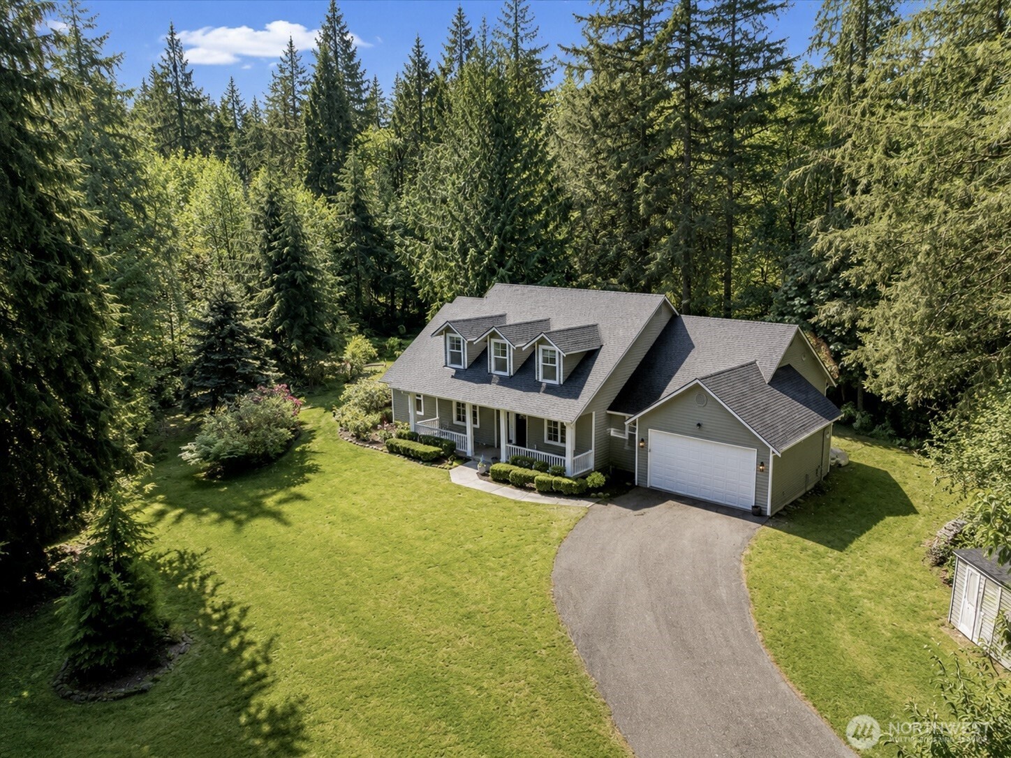33606 Northeast Lake Joy Road Carnation, WA 98014 - Photo 1 of 40 an aerial view of a house with swimming pool
