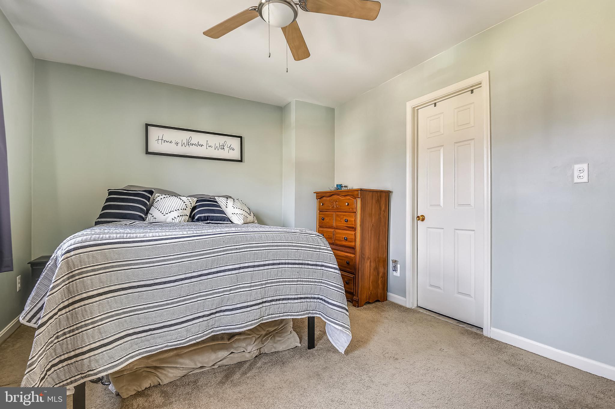 1081 Downton Road Halethorpe, MD 21227 - Photo 28 of 36 a bedroom with a bed and a painting on the wall