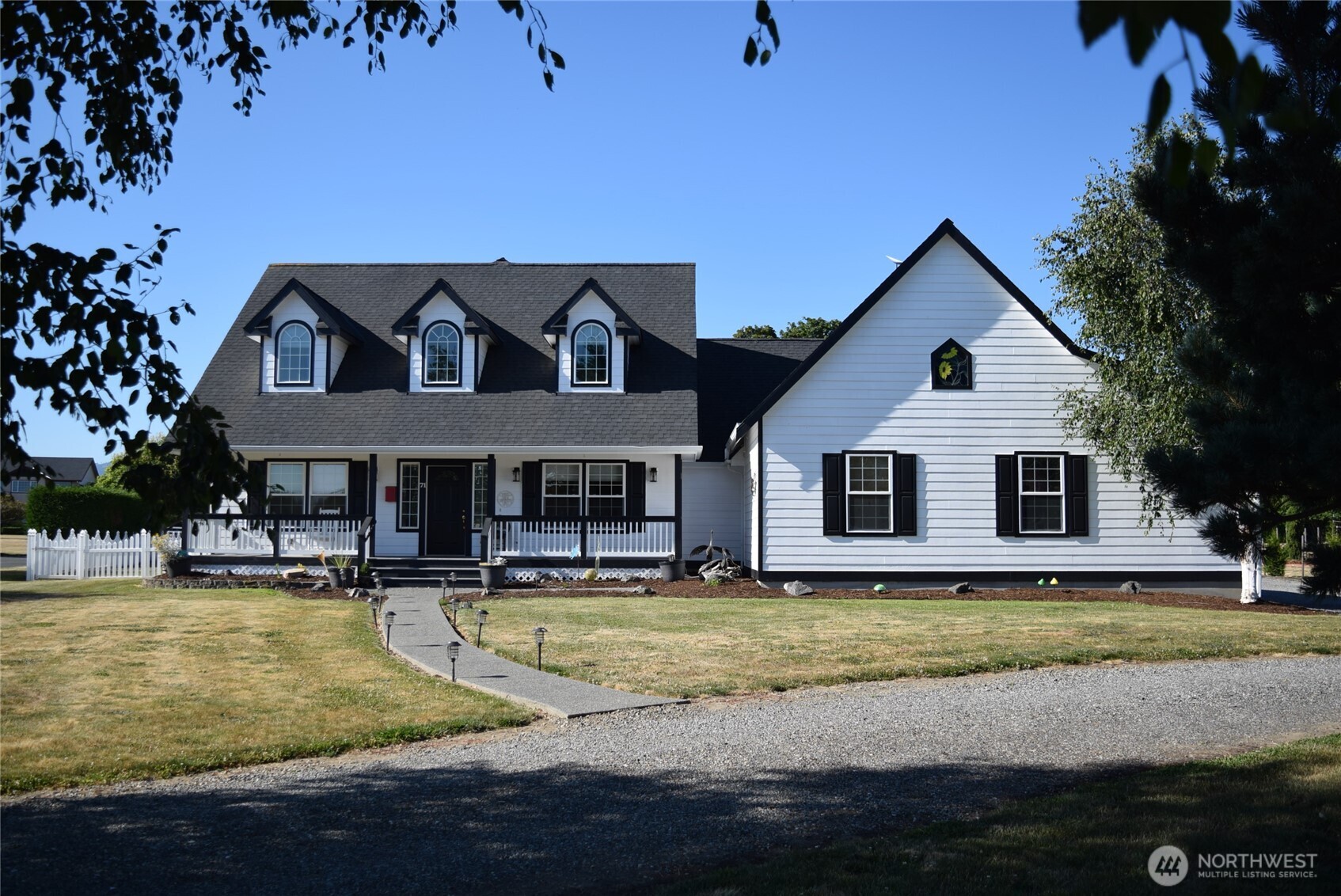 71 John Carl Road Sequim, WA 98382 - Photo 1 of 37 a view of a house with swimming pool
