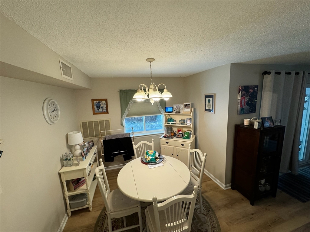 3 Beal's Cove Road, Unit H Hingham, MA 02043 - Photo 7 of 13 a dining room with furniture and window