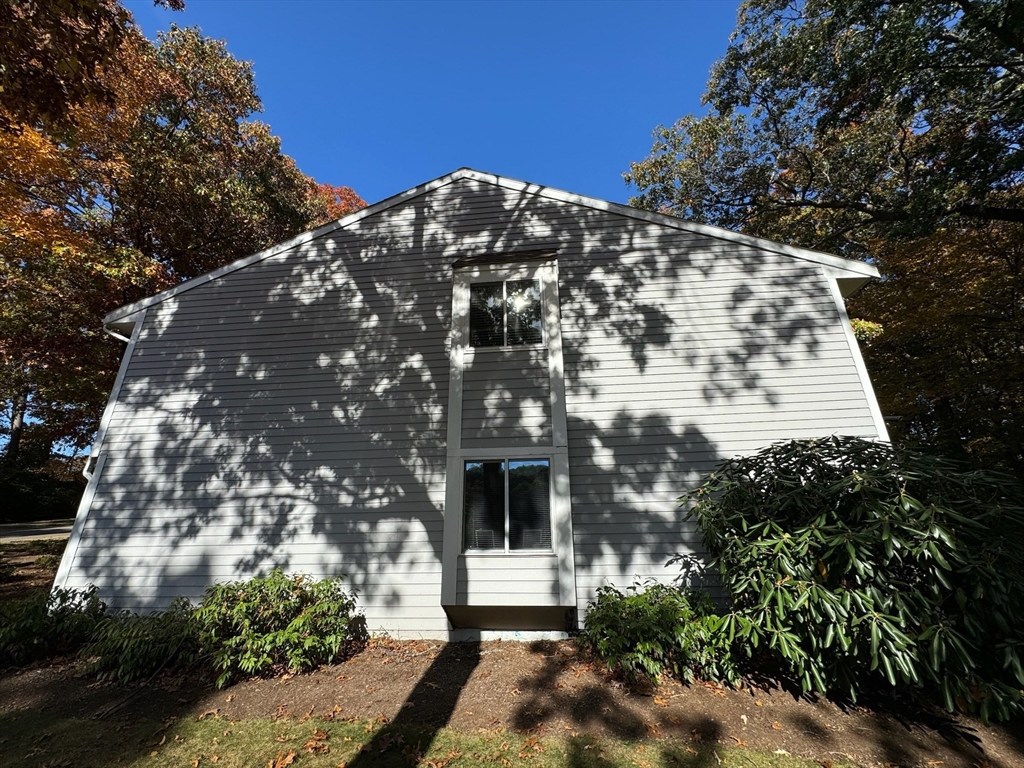 3 Beal's Cove Road, Unit H Hingham, MA 02043 - Photo 10 of 13 a front view of a house with a yard