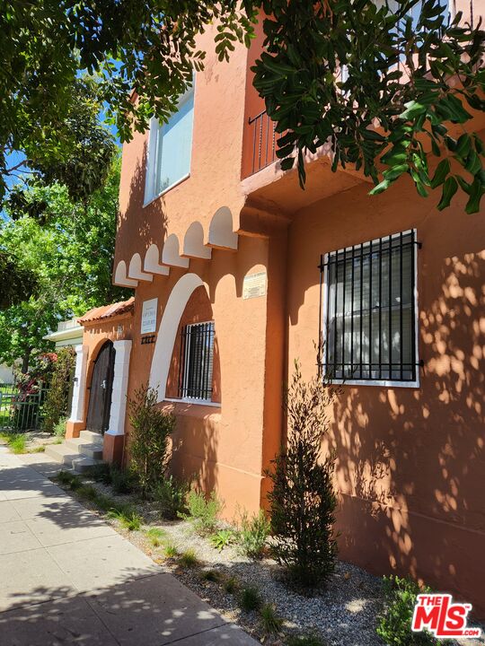 1217 Cedar Avenue Long Beach, CA 90813 - Photo 2 of 15 a front view of a house with a yard