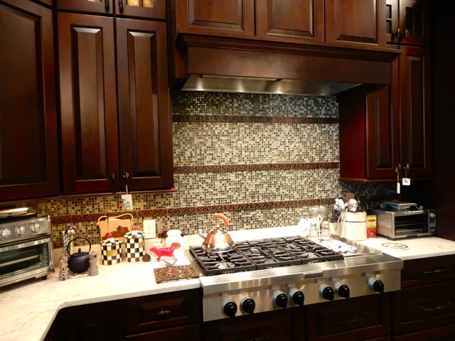 a living room with furniture a chandelier and a fireplace