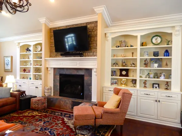 a room with a black white checkered floor with a sink and wooden floor