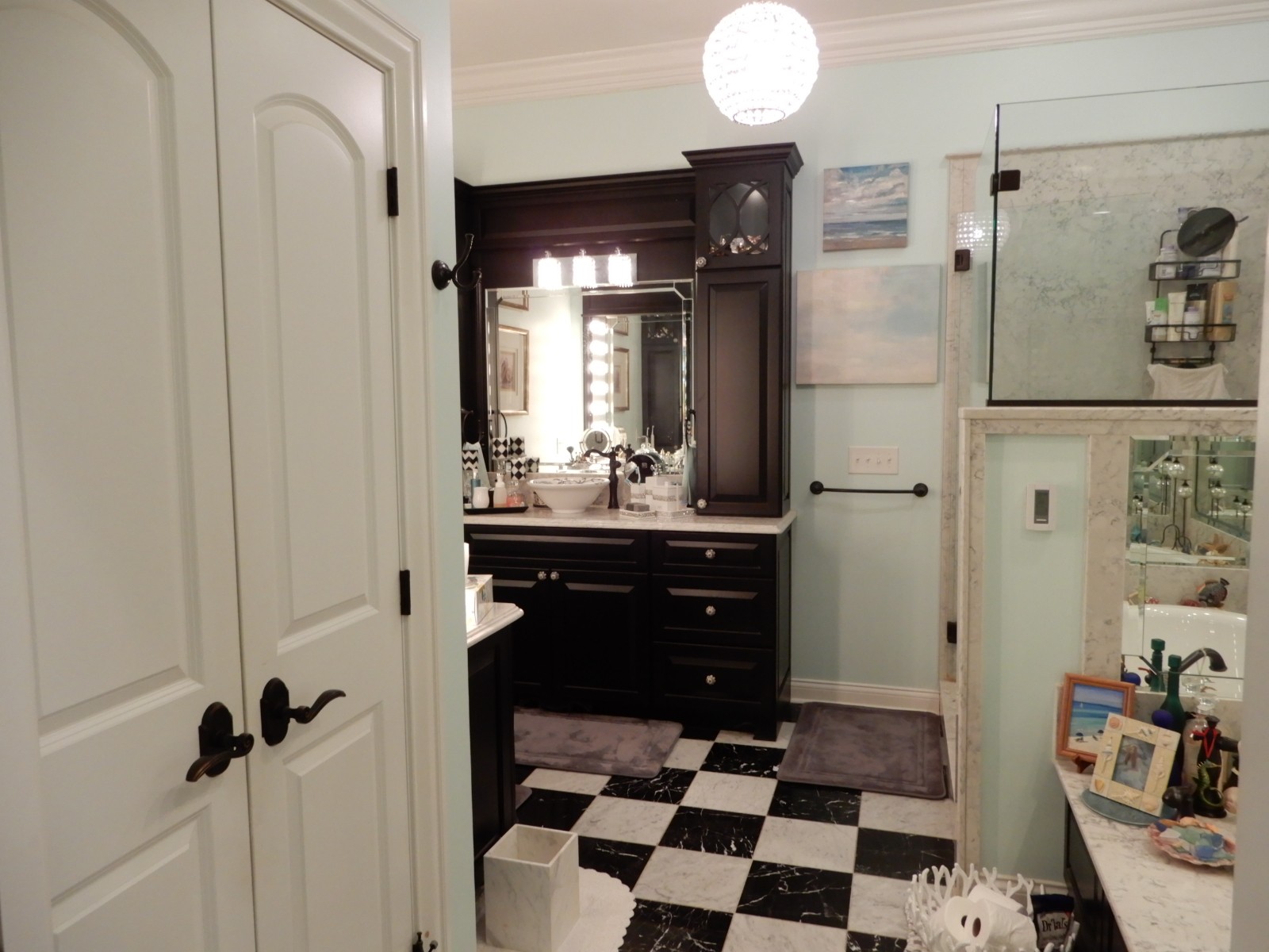 135 Allegheny Road Gilbertsville, KY 42044 - Photo 40 of 78 a room with a black white checkered floor with a sink and wooden floor