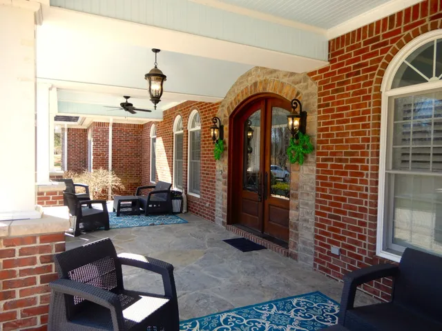 a living room with fireplace furniture and a flat screen tv