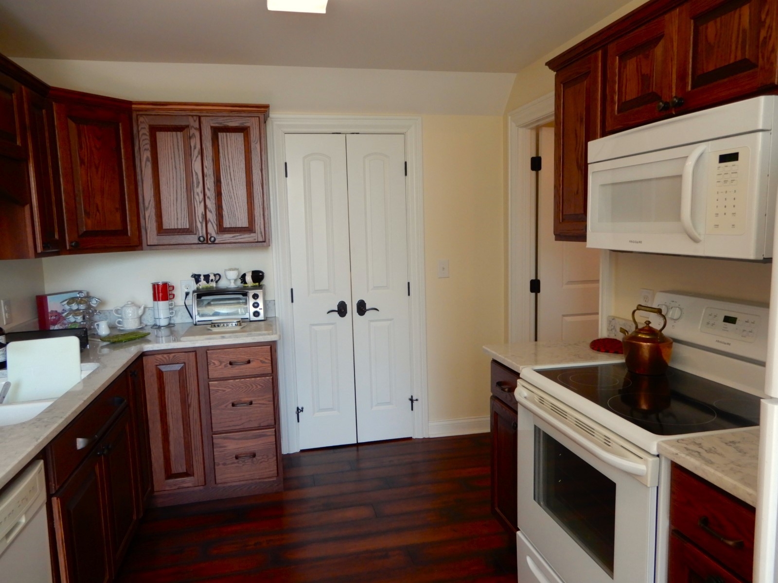 135 Allegheny Road Gilbertsville, KY 42044 - Photo 64 of 78 a kitchen with a sink a stove and cabinets