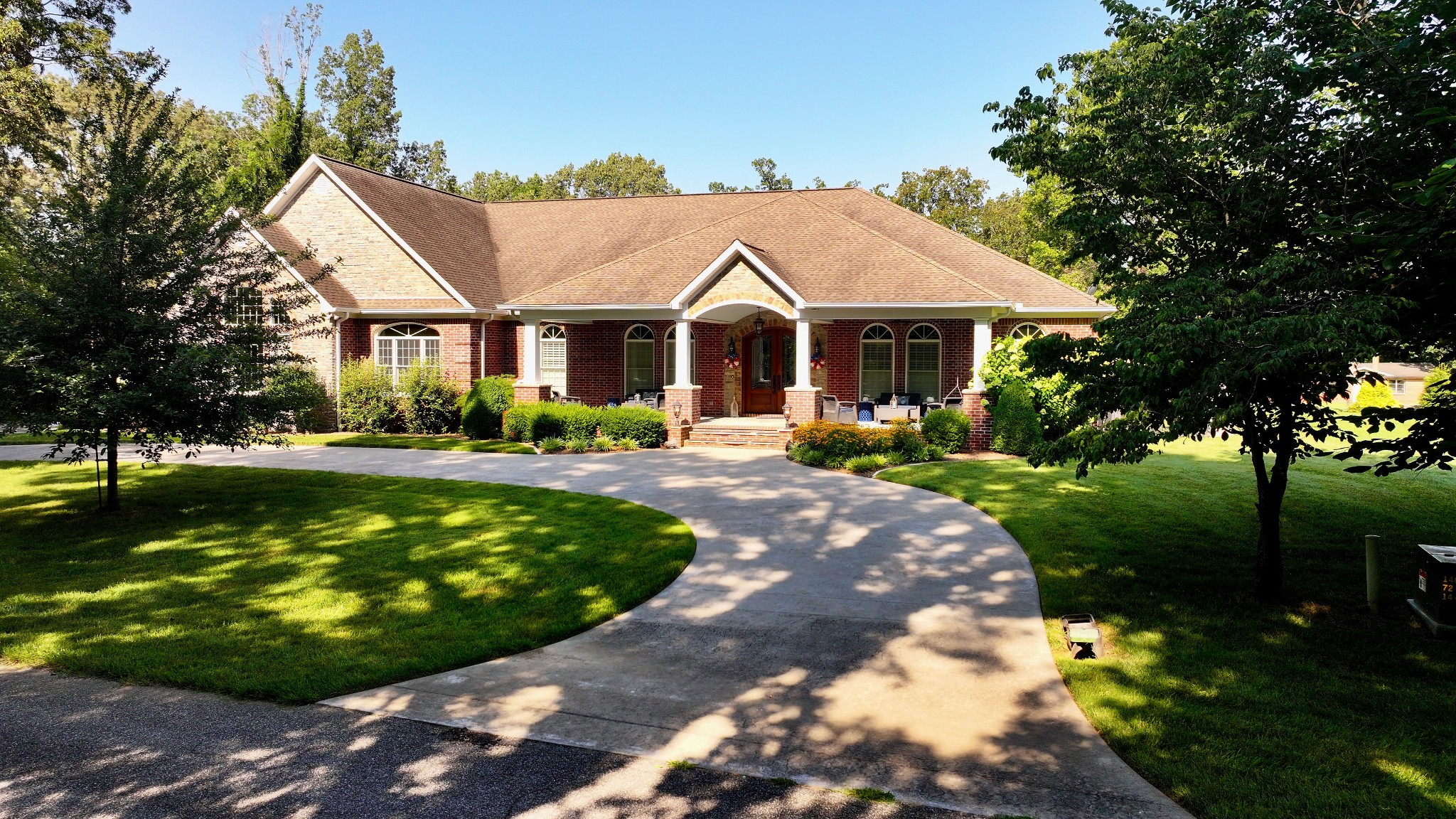 135 Allegheny Road Gilbertsville, KY 42044 - Photo 76 of 78 a front view of a house with a garden and trees
