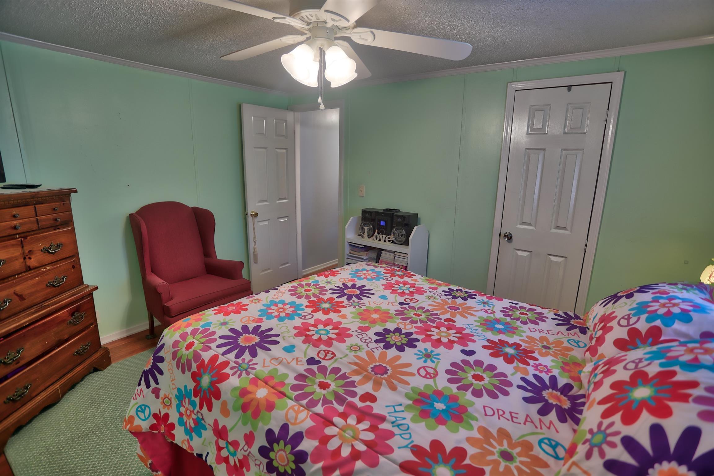 952 North Corinth Road Portland, TN 37148 - Photo 17 of 25 a bedroom with a bed and furniture