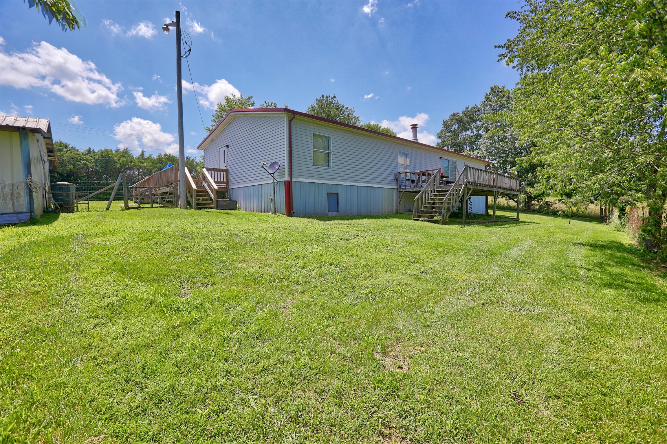 952 North Corinth Road Portland, TN 37148 - Photo 21 of 25 a house view with a garden space