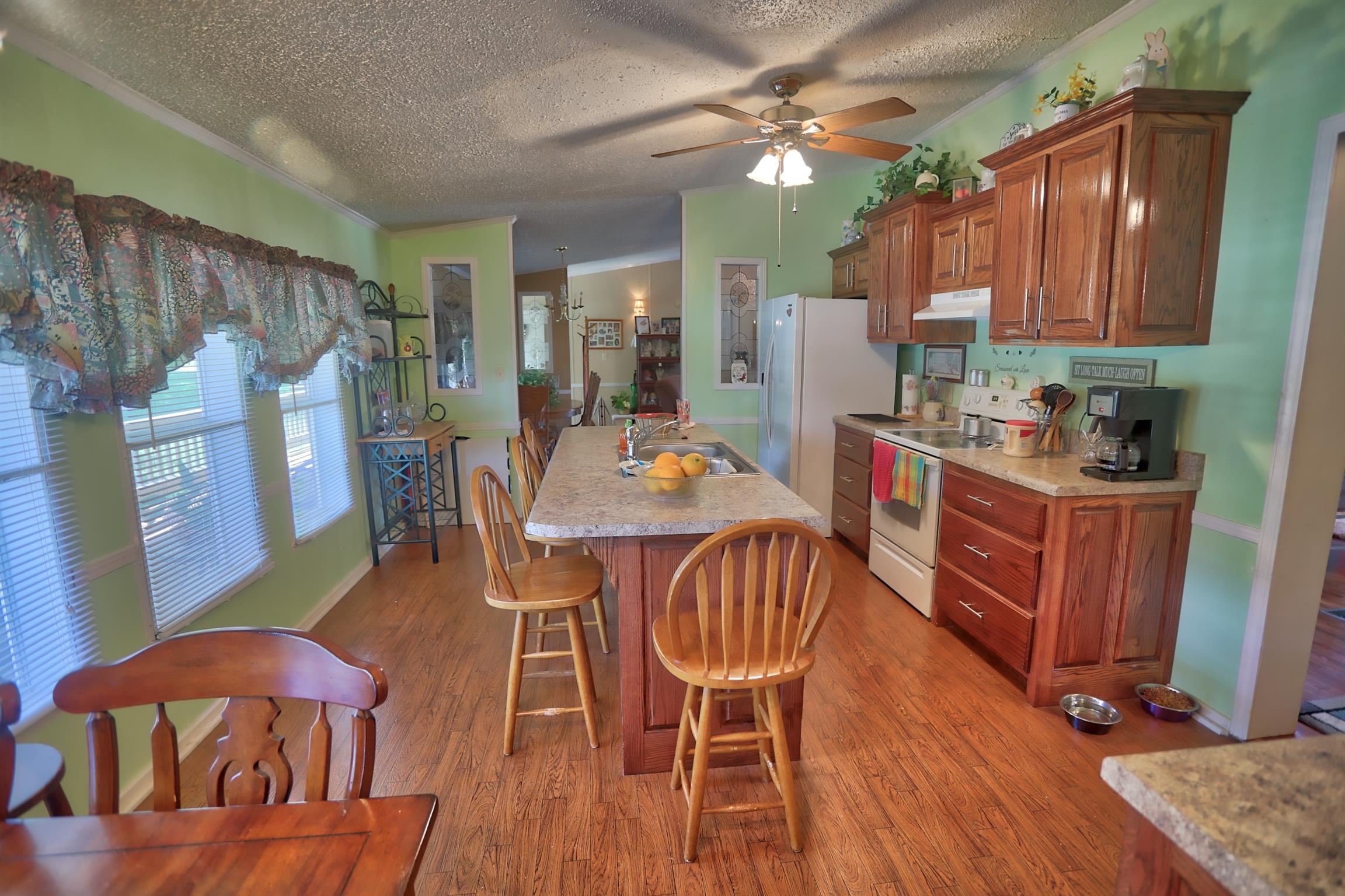952 North Corinth Road Portland, TN 37148 - Photo 8 of 25 a view of a dining room with furniture window and wooden floor