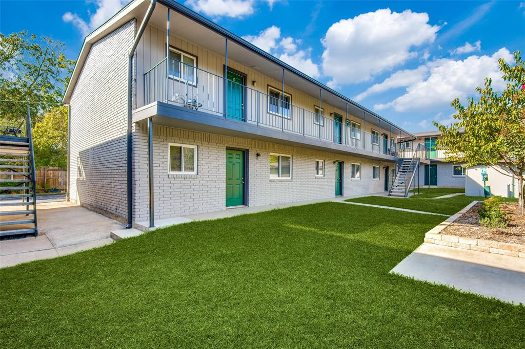 2211 West Hickory Street, Unit A4 Denton, TX 76201 - Photo 14 of 14 a view of a house with a yard