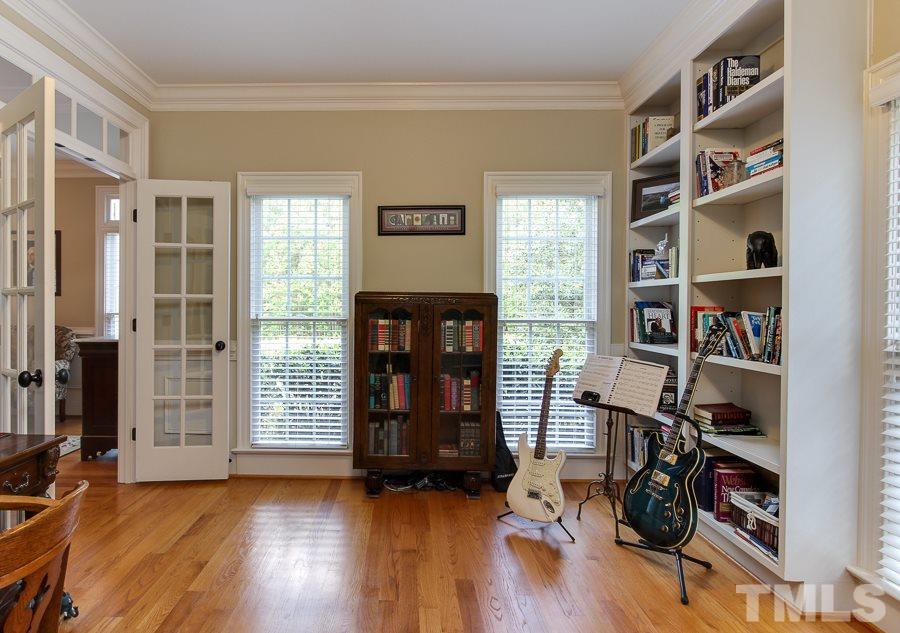 936 Oak Creek Road Raleigh, NC 27615 - Photo 5 of 25 a view of room with wooden floor and closet