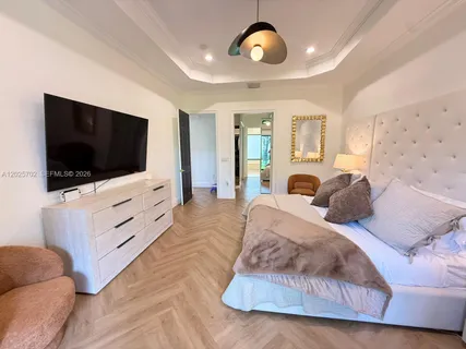a living room with a bed furniture and a window