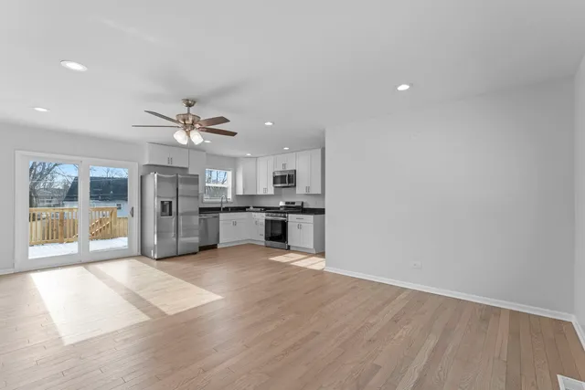 a view of a kitchen with a sink and a window