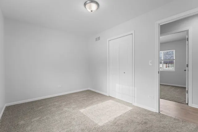 an empty room with a bench