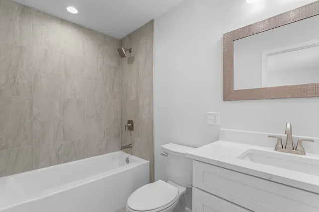 a bathroom with a sink toilet and bathtub
