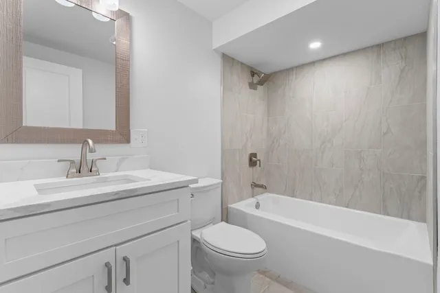 a bathroom with a sink toilet and bathtub