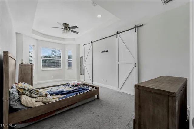 a bedroom with a bed and dresser