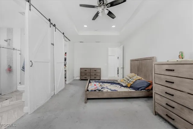 a view of walk in closet with clothes